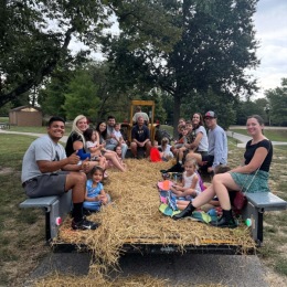 people on a fall hayride
