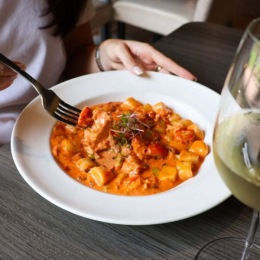 a woman eating a dinner dish