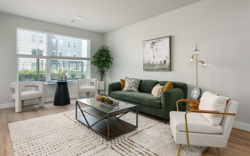 a living room with a couch and chairs