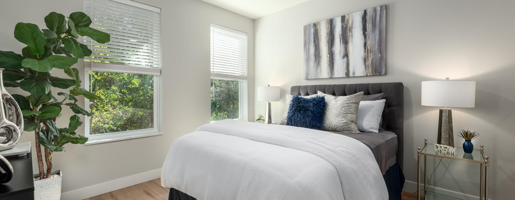 a bedroom with a bed and a fan