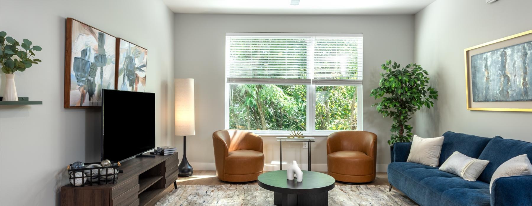 a living room with a blue couch